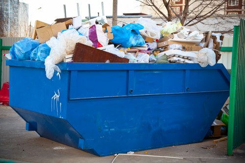 Waste management professionals handling construction debris