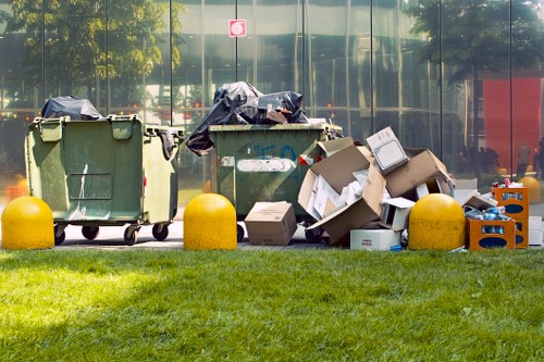 Segregated green waste and recycling bins ready for collection