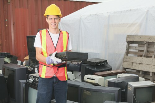 Recyclable materials being sorted for waste removal